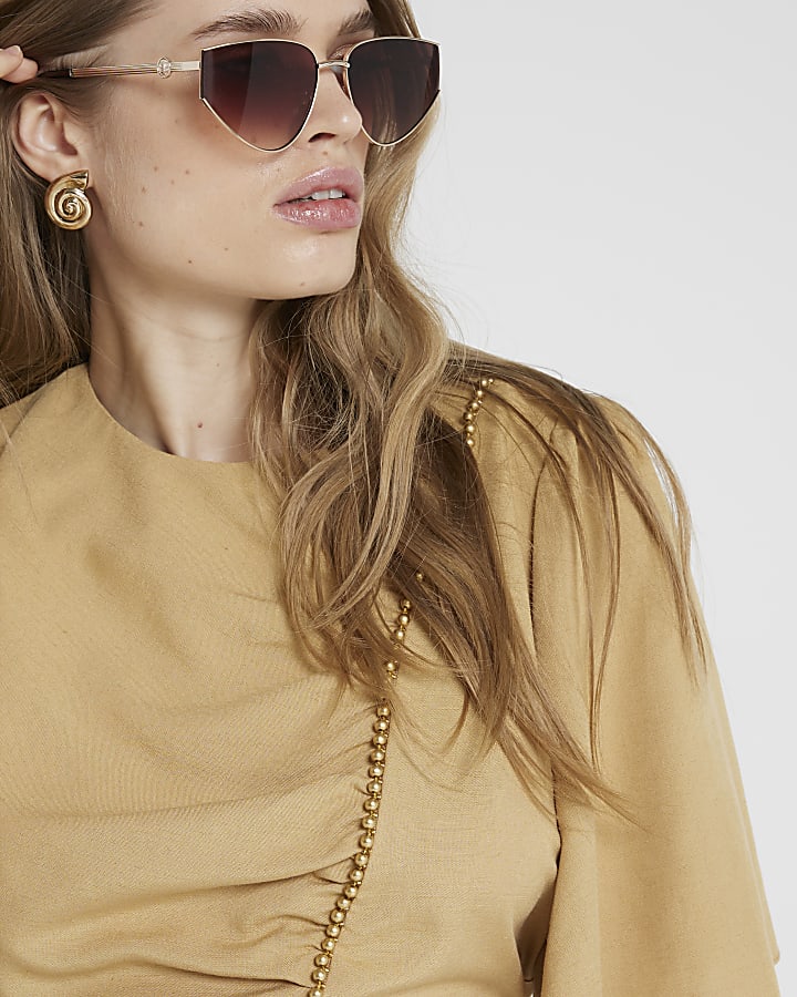 Beige beaded peplum top