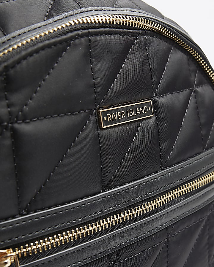 Black quilted zip backpack