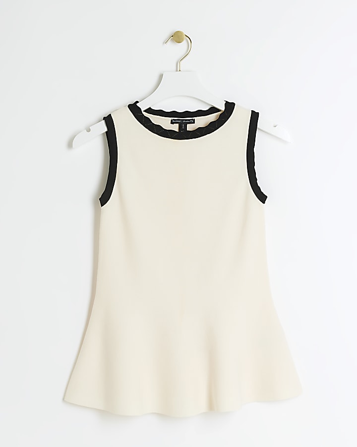 Cream knit peplum vest top