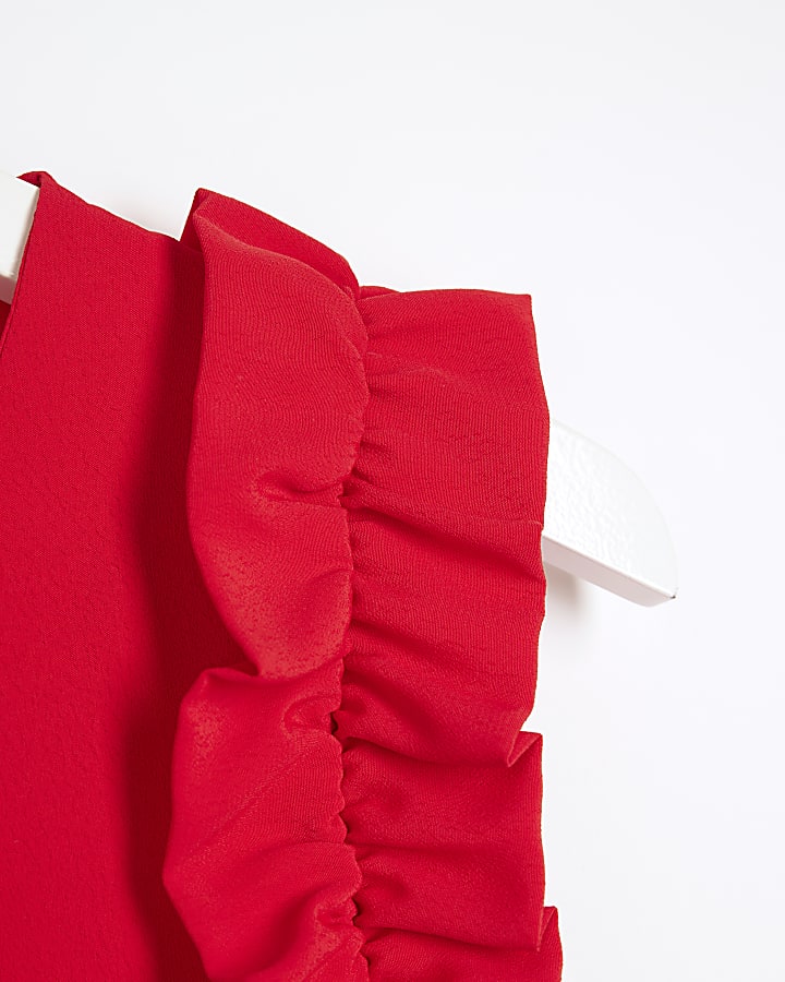 Red sleeveless frill detail top