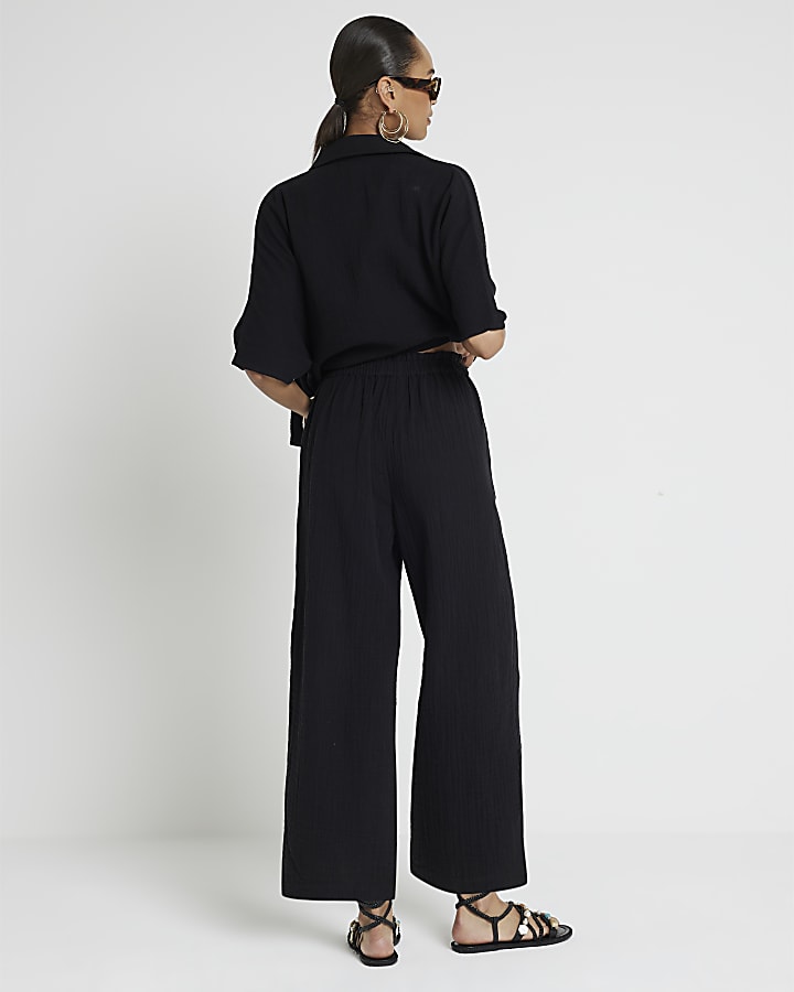 Black cropped trousers