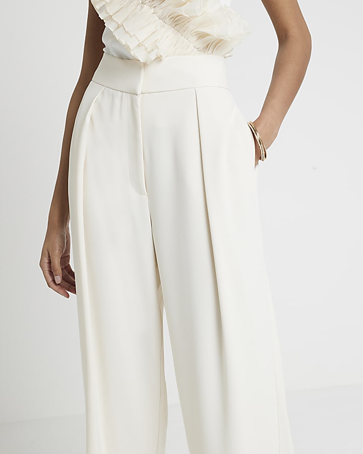 Cream pleated wide leg trousers