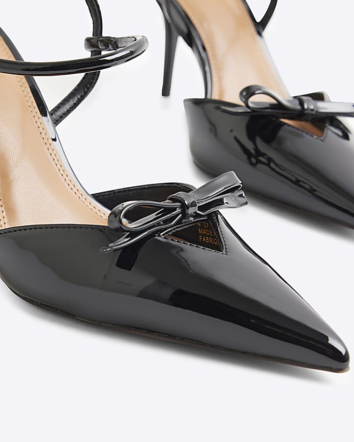Black patent bow sling back heeled shoes