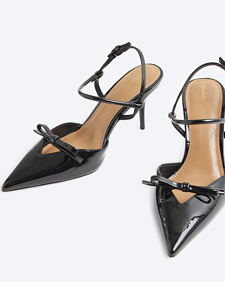 Black patent bow sling back heeled shoes