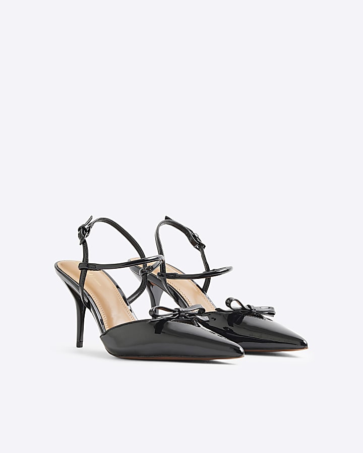 Black patent bow sling back heeled shoes