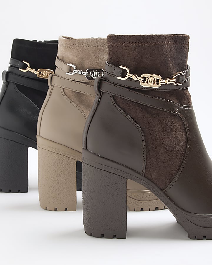 Brown hardware strap heeled boots