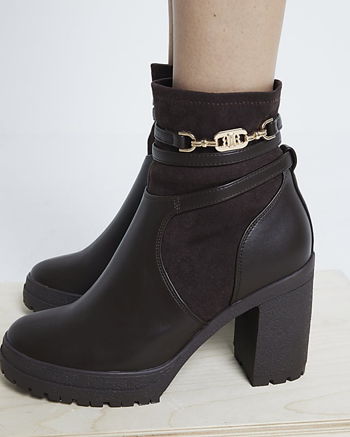 Brown hardware strap heeled boots River Island