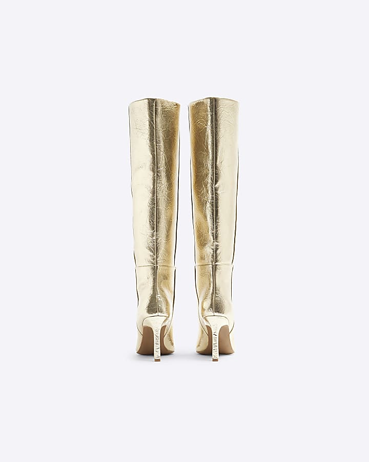 Gold heeled high leg boots
