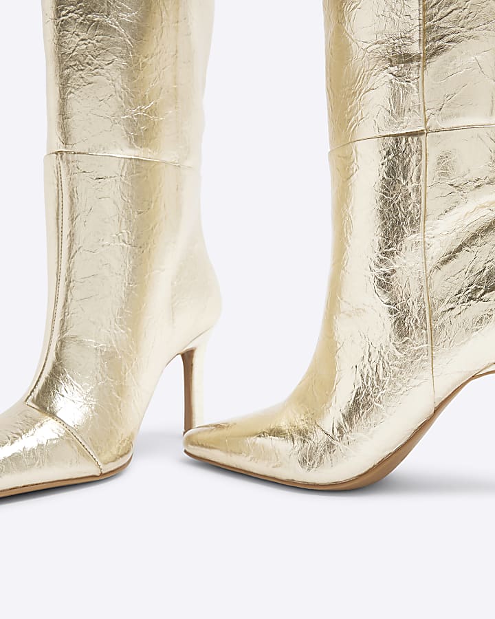 Gold heeled high leg boots