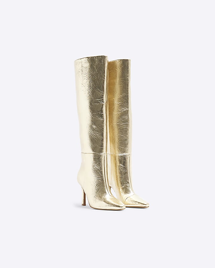 Gold heeled high leg boots