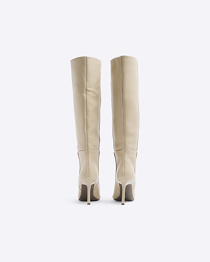 Beige heeled high leg boots