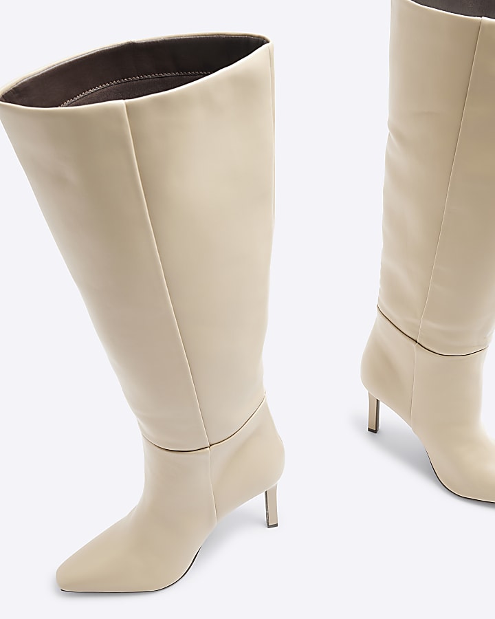 Beige heeled high leg boots