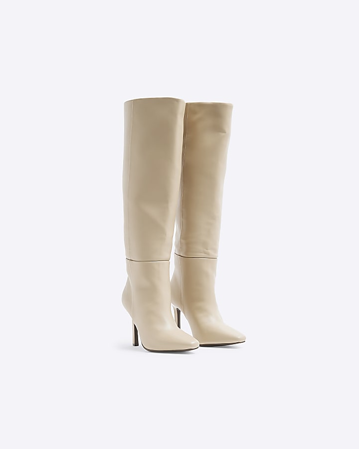 Beige heeled high leg boots