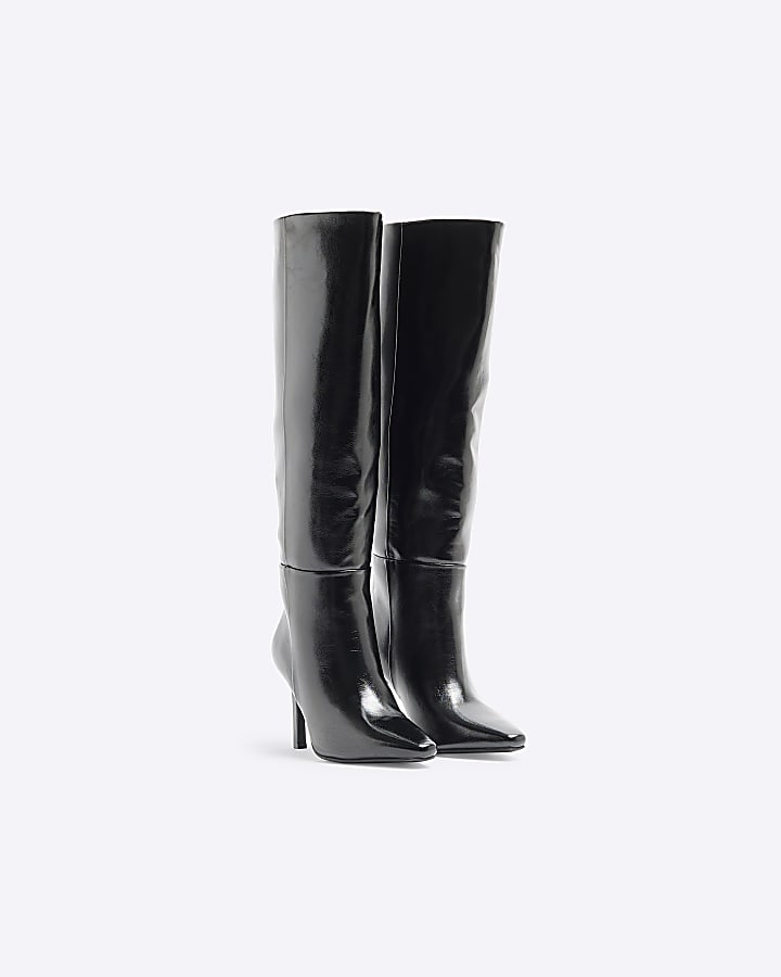 Black heeled high leg boots