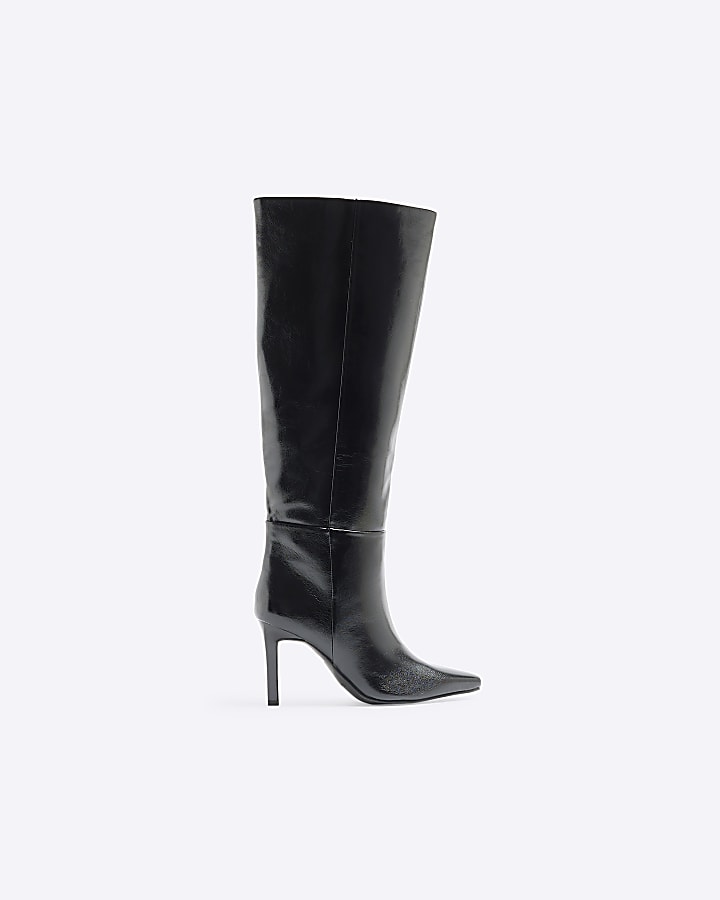 Black heeled high leg boots