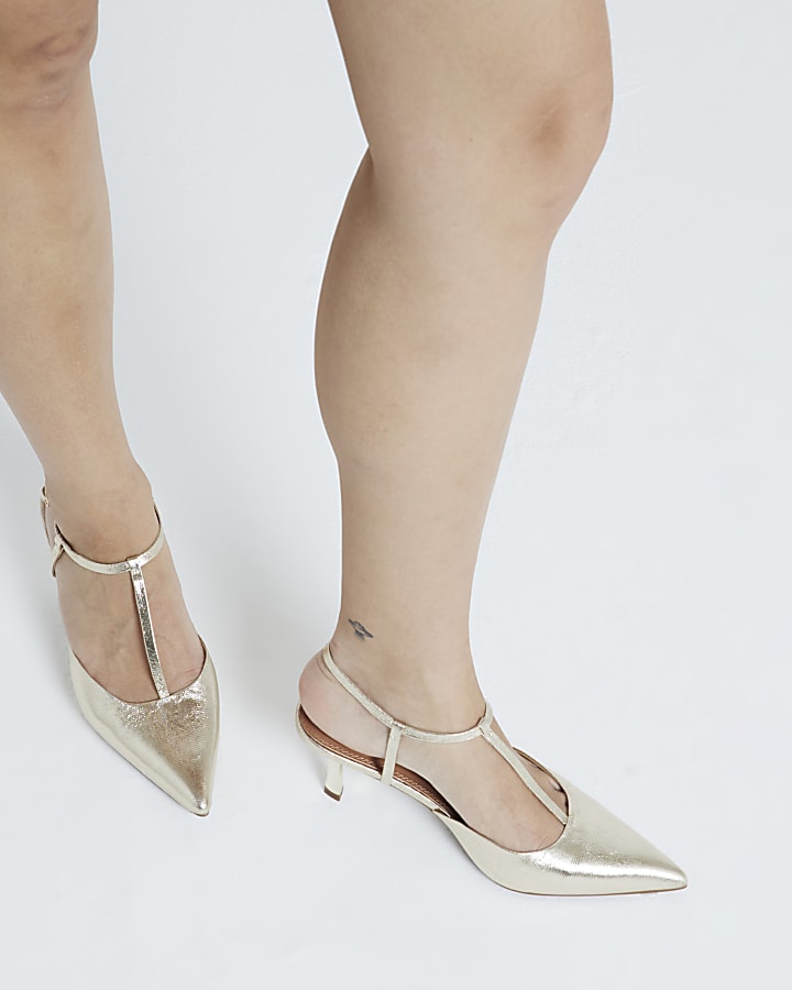 Gold sling back heeled court shoes