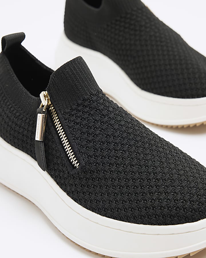 Black knitted wedge trainers