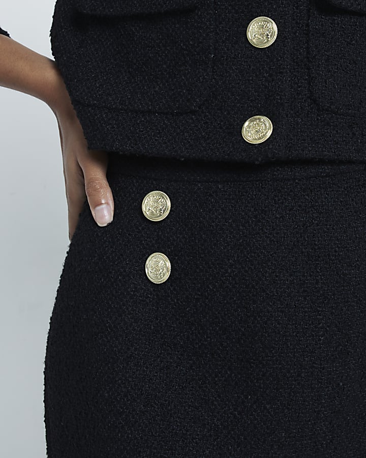 Black boucle button detail mini skirt