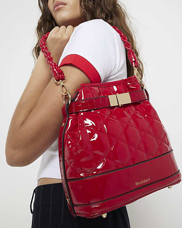 Red patent quilted bucket bag River Island