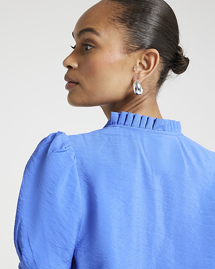 Blue frill neck blouse