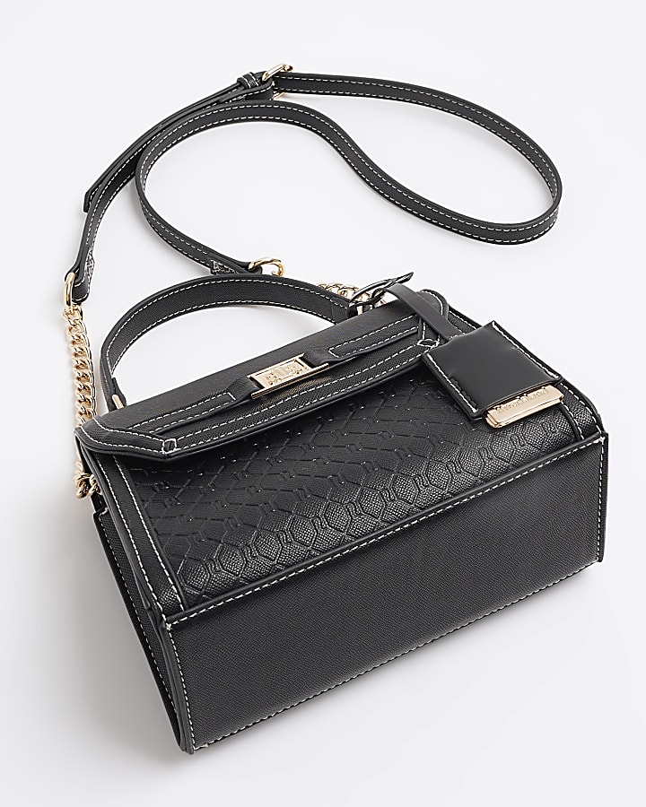 Black embossed mini top handle cross body bag