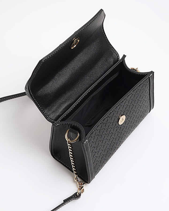 Black embossed mini top handle cross body bag
