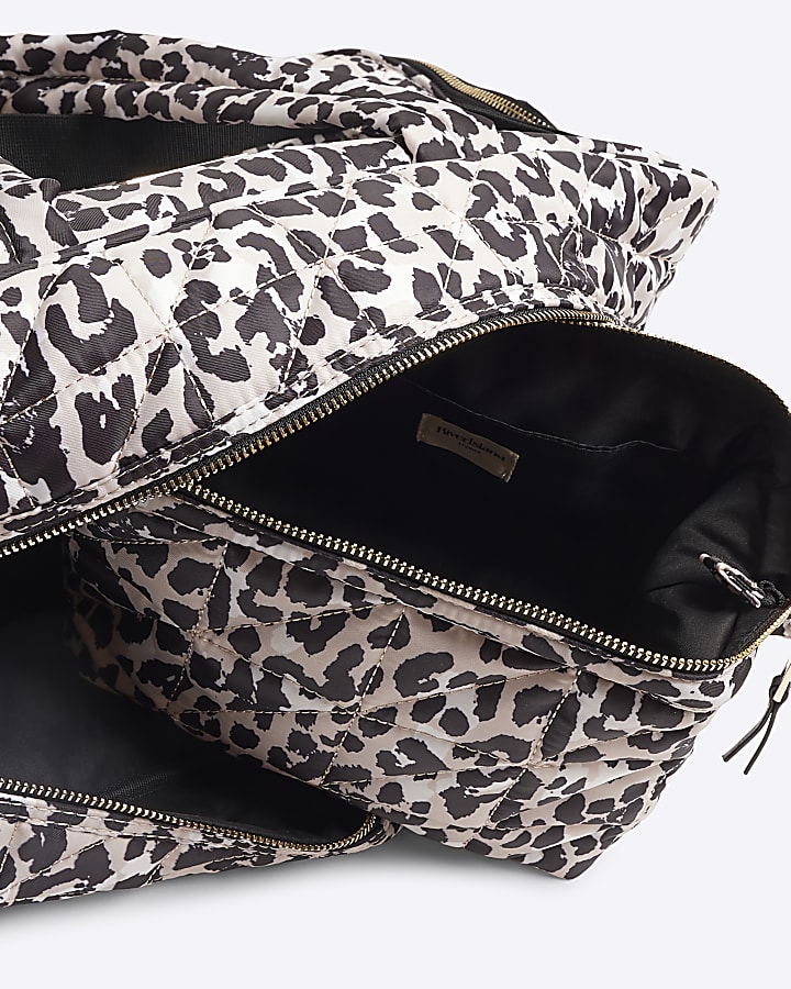 Beige quilted leopard travel and makeup bag