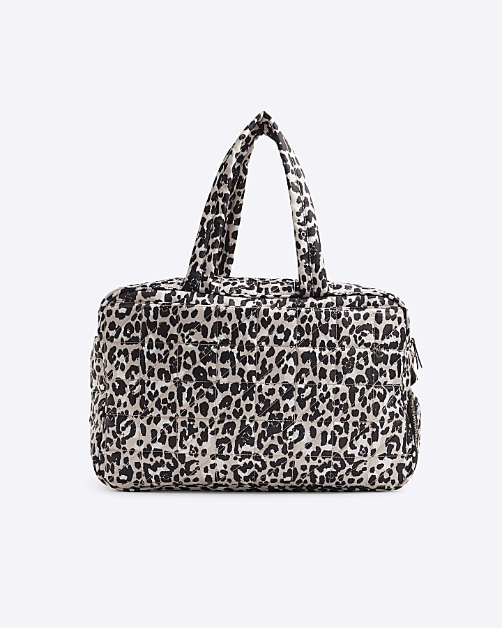 Beige quilted leopard print travel bag