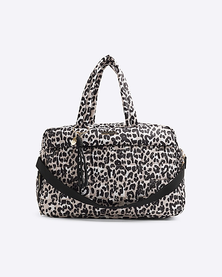 Beige quilted leopard print travel bag