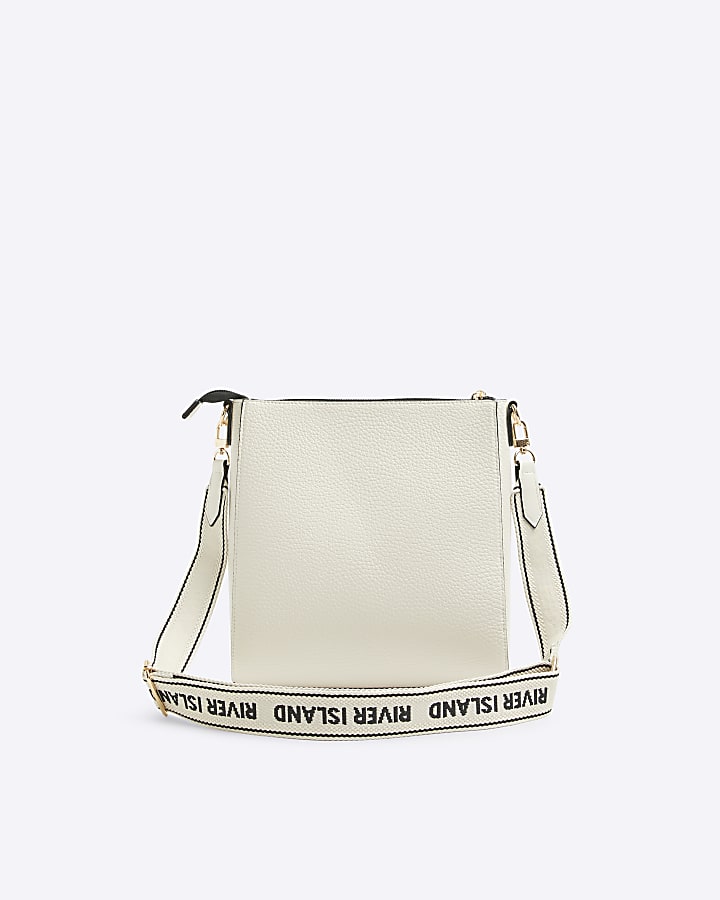 Cream embossed cross body bag