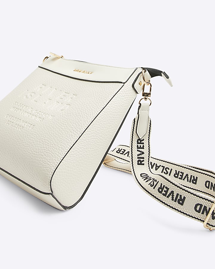 Cream embossed cross body bag