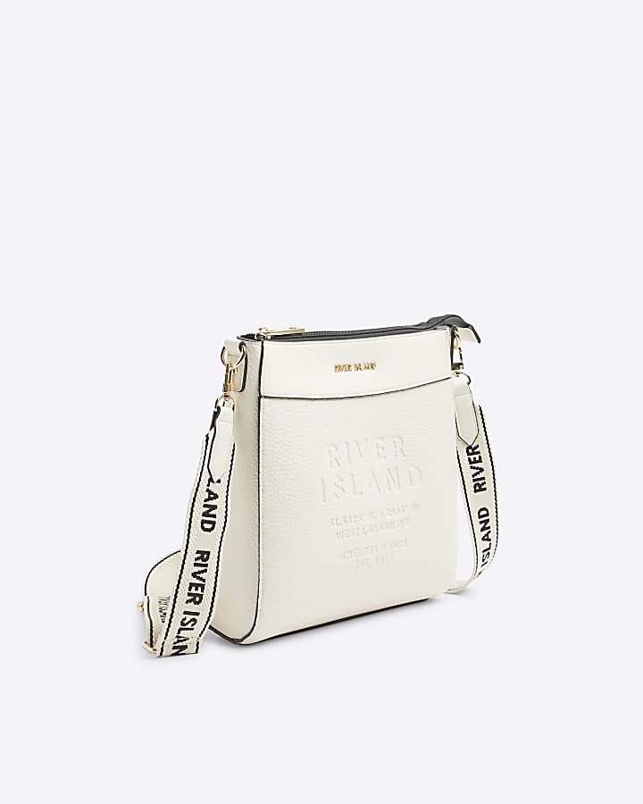 Cream embossed cross body bag