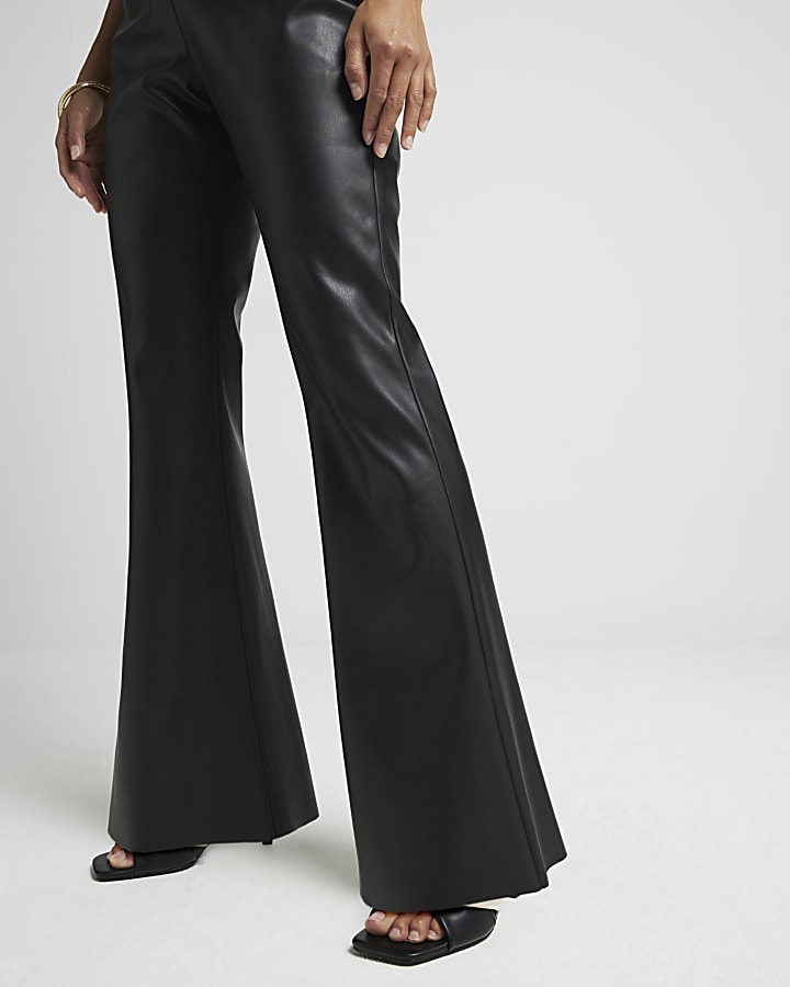 Petite Black faux leather flared trousers