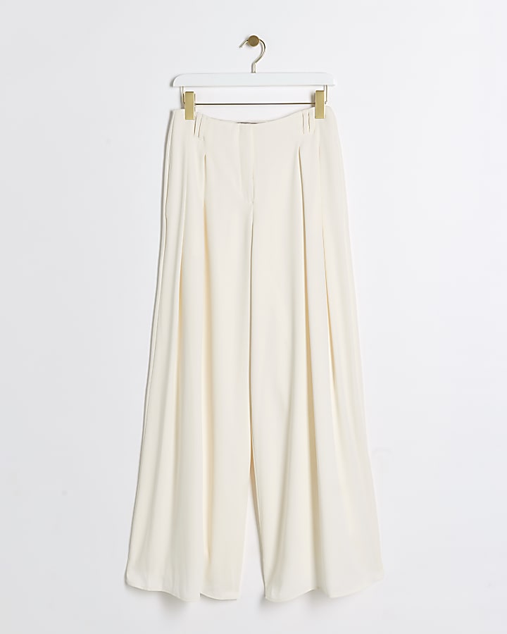 Cream pleated wide leg trousers