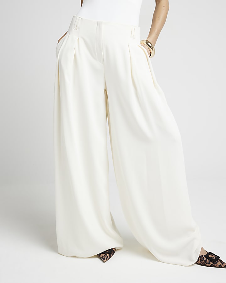 Cream pleated wide leg trousers