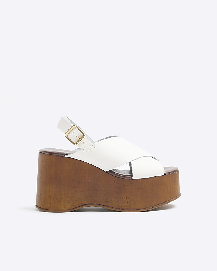 Beige leather cross strap wedge sandals