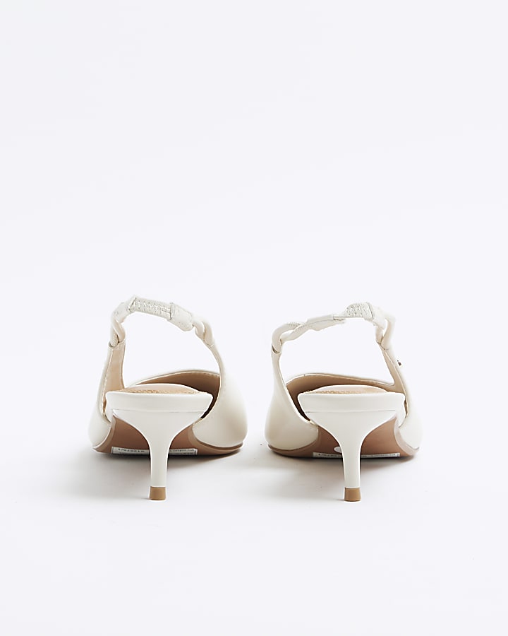 Cream heeled sling back court shoes