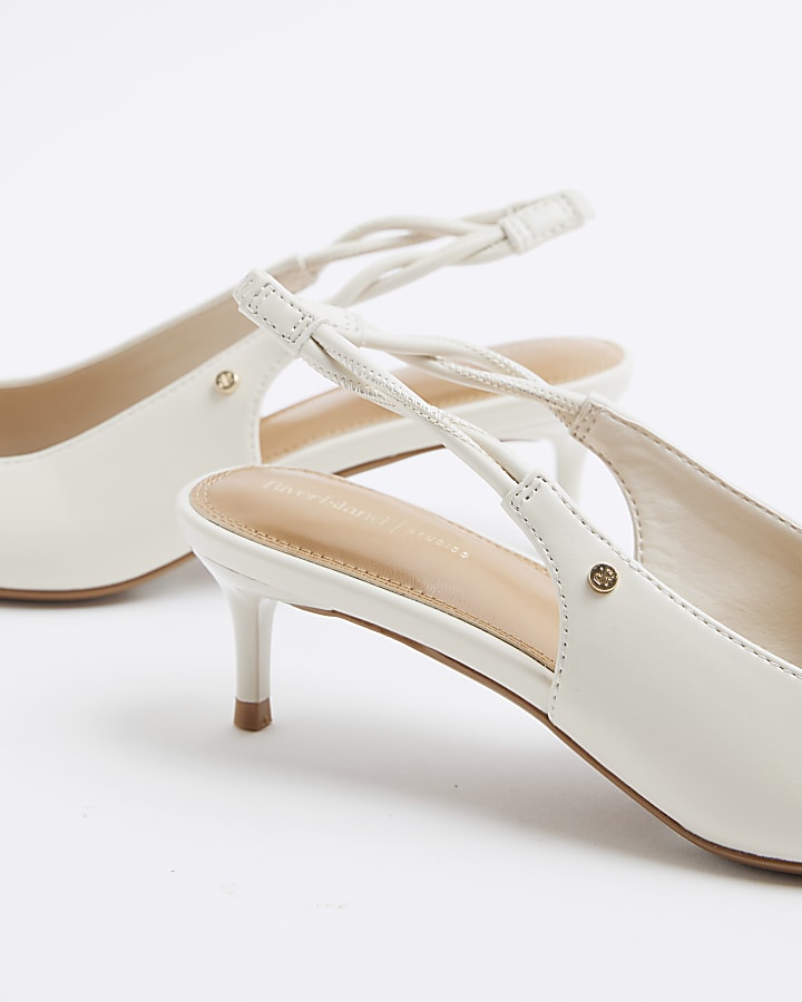 Cream heeled sling back court shoes