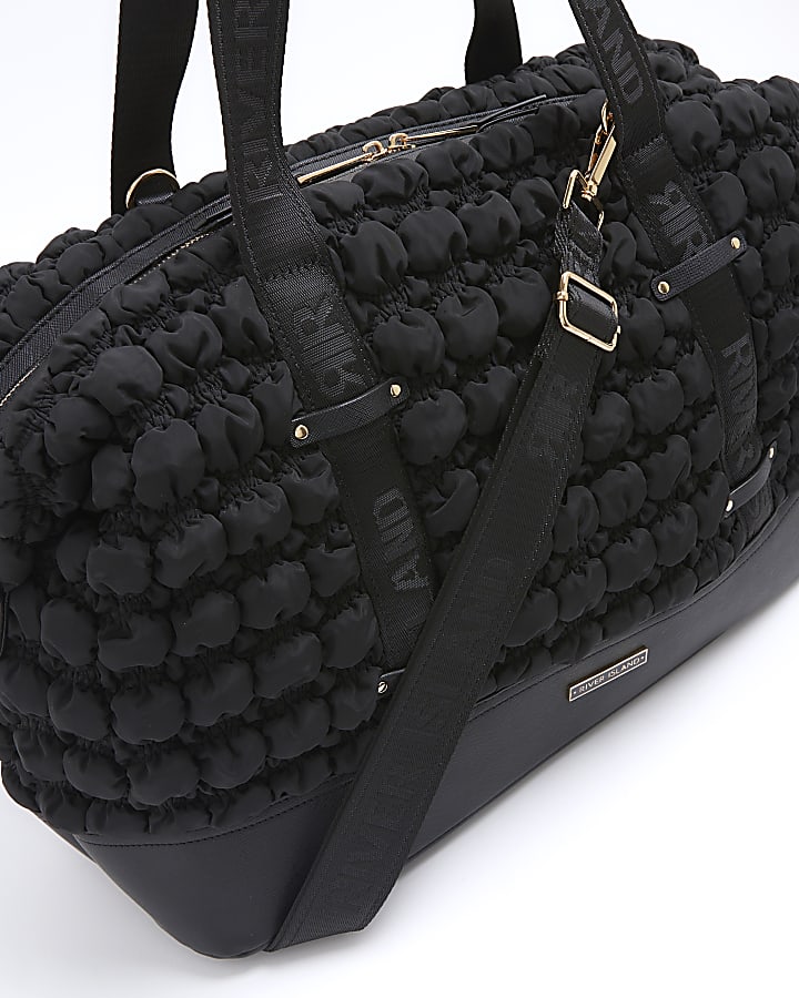 Black quilted texture travel bag