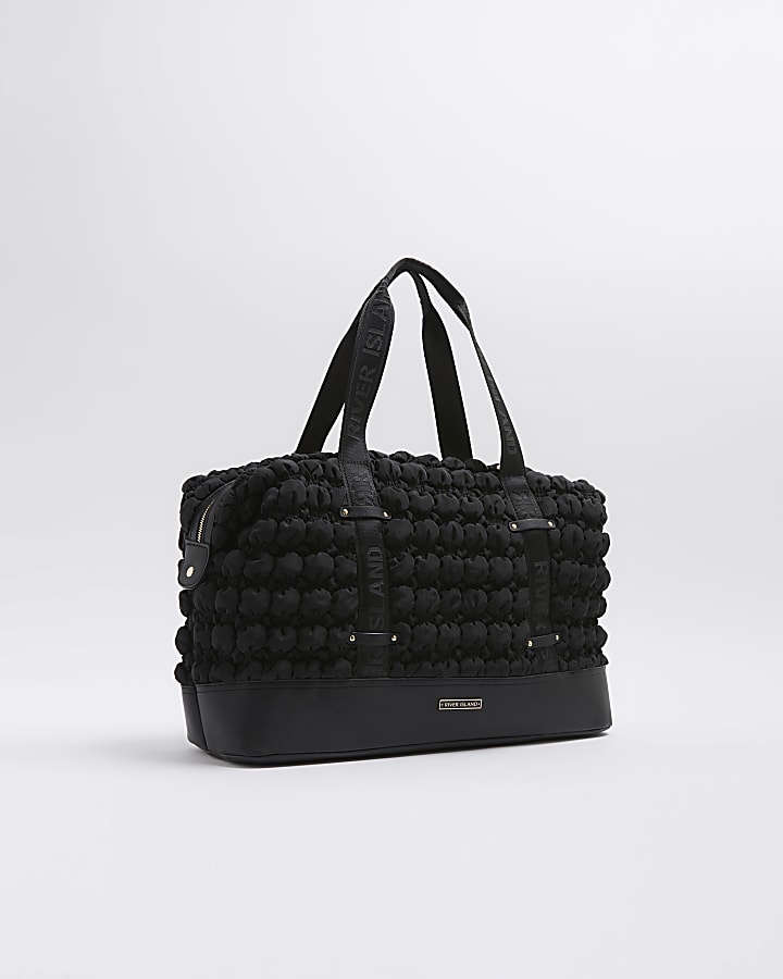 Black quilted texture travel bag