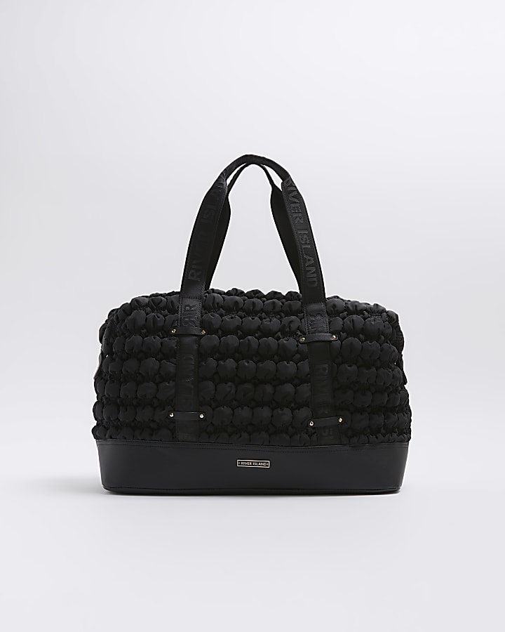 Black quilted texture travel bag