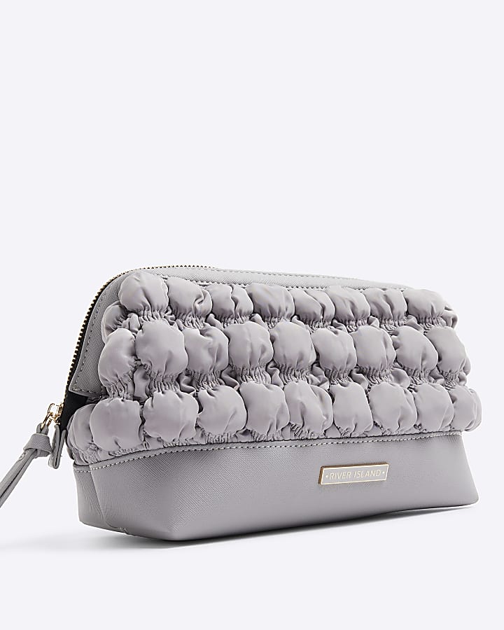 Grey quilted makeup bag