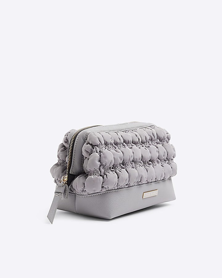 Grey quilted makeup bag