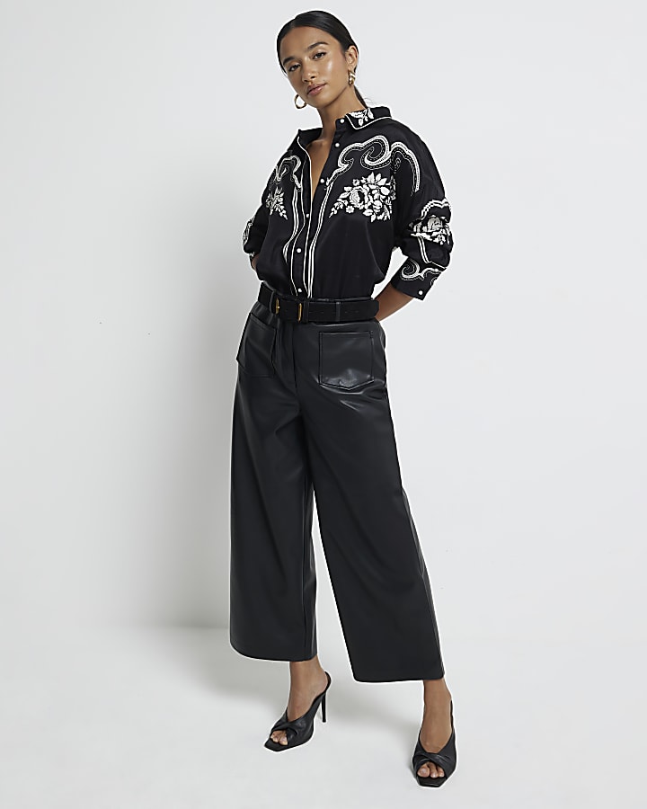 Petite black faux leather cropped trousers River Island