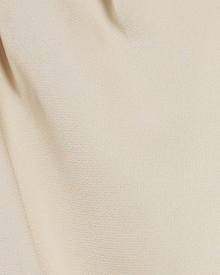 Cream one shoulder cuffed blouse