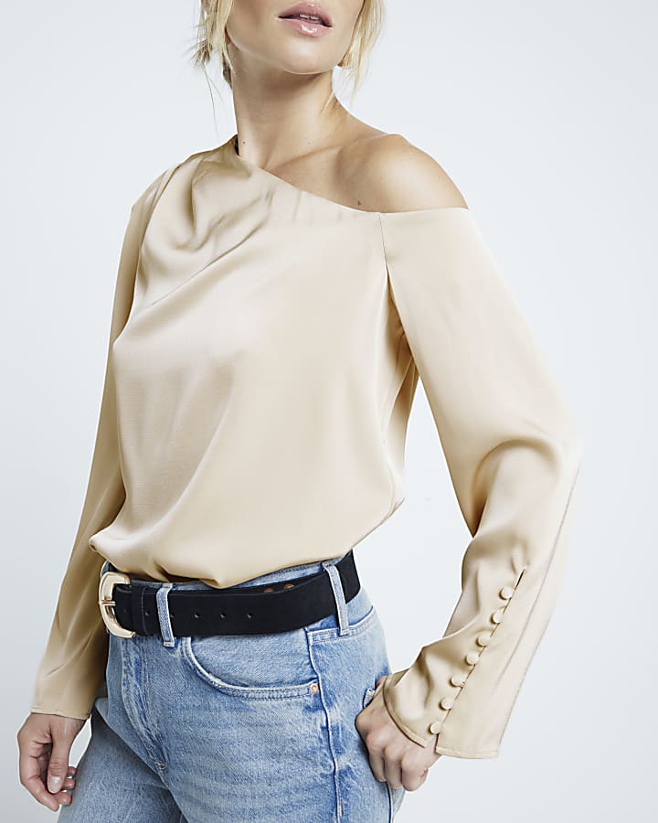 Cream one shoulder cuffed blouse