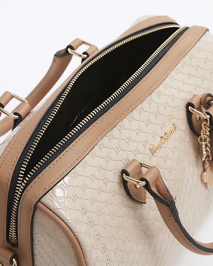 Beige embossed monogram bowler handbag
