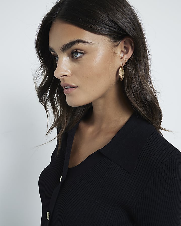 Black knit button detail polo top