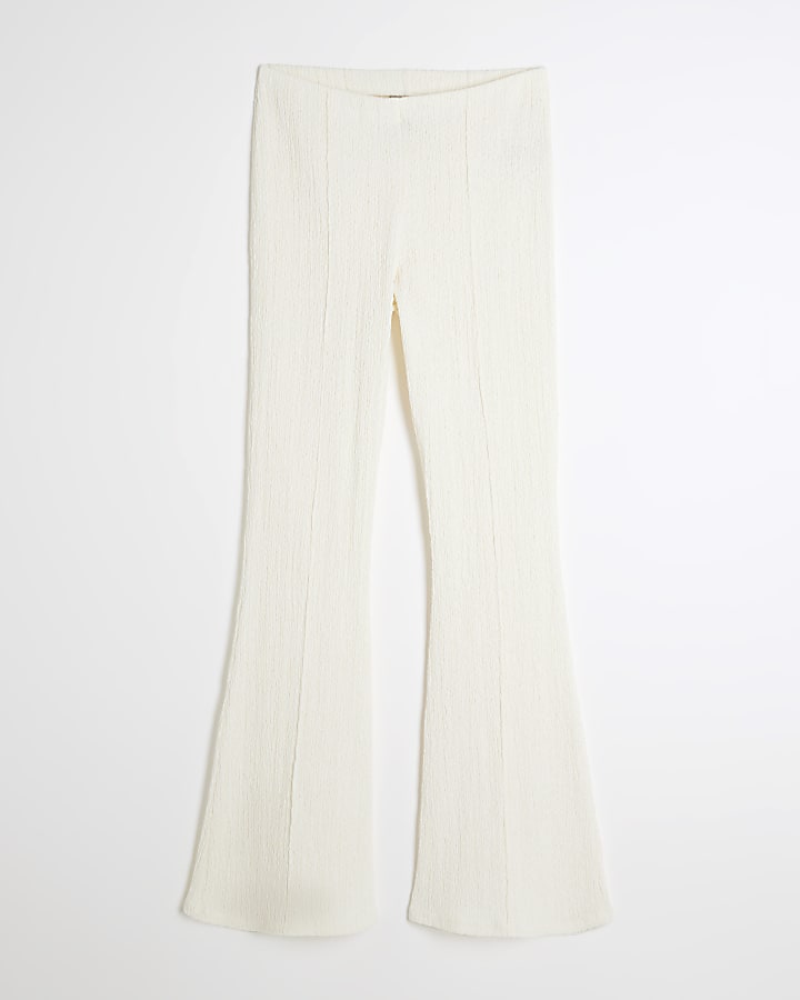 Cream textured flared trousers