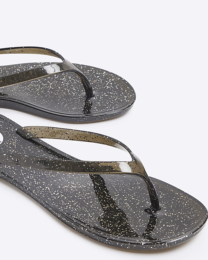 Black metallic jelly flip flop sandals